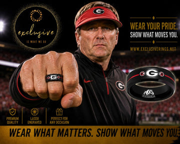 Georgia Bulldogs football head coach, Kirby Smart wearing a black and red ring with the Georgia Bulldogs logo engraved on the inside and outside.  The ring is exclusively designed and sold by exclusiverings.net.